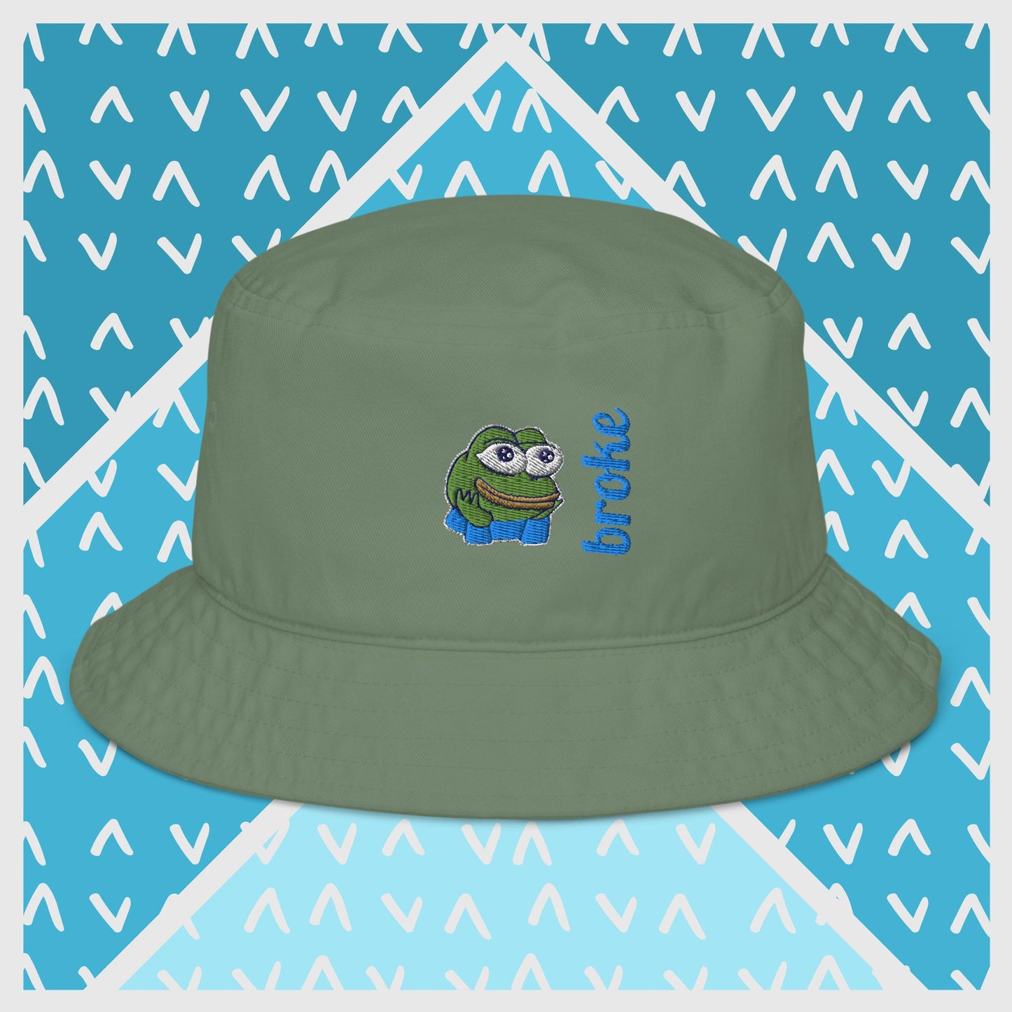 Pepe the Frog bucket hat in green with high-quality embroidery of Pepe wearing blue shirt, paired with the word 'broke' in bold blue stitching. Trendy streetwear accessory for meme enthusiasts, perfect for casual outfits and internet culture fans.