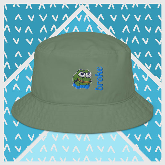 Pepe the Frog bucket hat in green with high-quality embroidery of Pepe wearing blue shirt, paired with the word 'broke' in bold blue stitching. Trendy streetwear accessory for meme enthusiasts, perfect for casual outfits and internet culture fans.