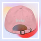 Unisex WOJAK embroidered dad hat with high-quality stitching, adjustable strap, and breathable cotton fabric. Perfect for meme lovers and streetwear enthusiasts.